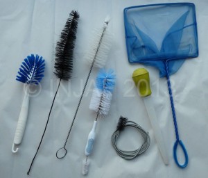 A variety of cleaning brushes, fish net and turkey baster!